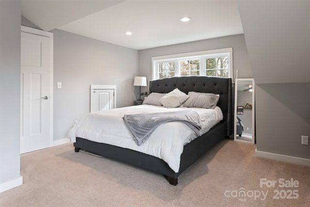 bedroom featuring recessed lighting, baseboards, and light carpet