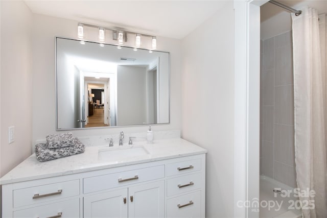 full bath with visible vents, shower / bath combo, and vanity