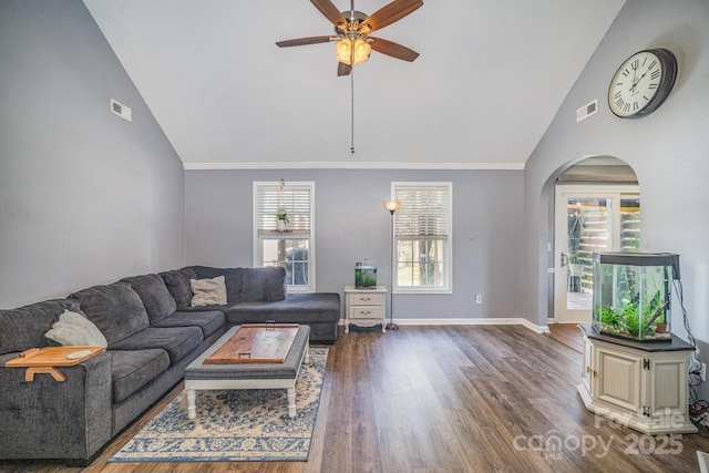 living area with a ceiling fan, wood finished floors, visible vents, baseboards, and ornamental molding