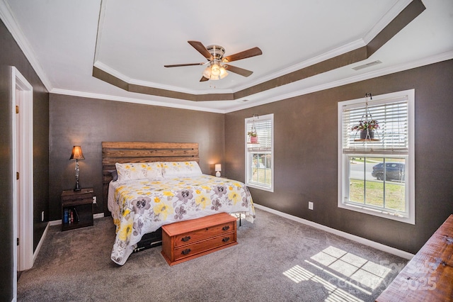 bedroom featuring carpet, visible vents, baseboards, crown molding, and a raised ceiling