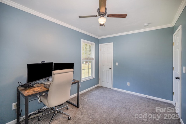 carpeted office with a ceiling fan, crown molding, and baseboards