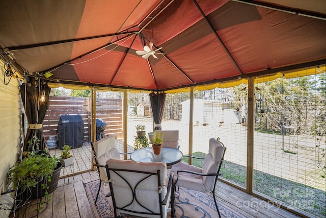 sunroom featuring a wealth of natural light and vaulted ceiling