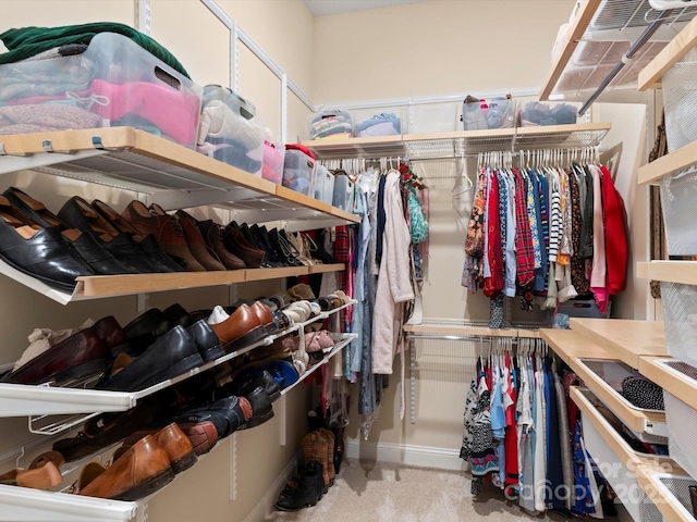 spacious closet with carpet floors