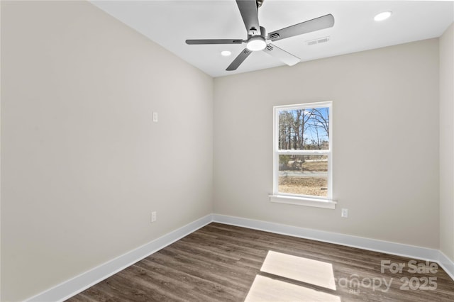 unfurnished room with recessed lighting, visible vents, baseboards, and dark wood-style flooring