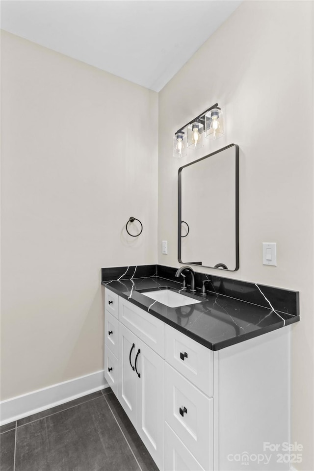 bathroom featuring vanity and baseboards