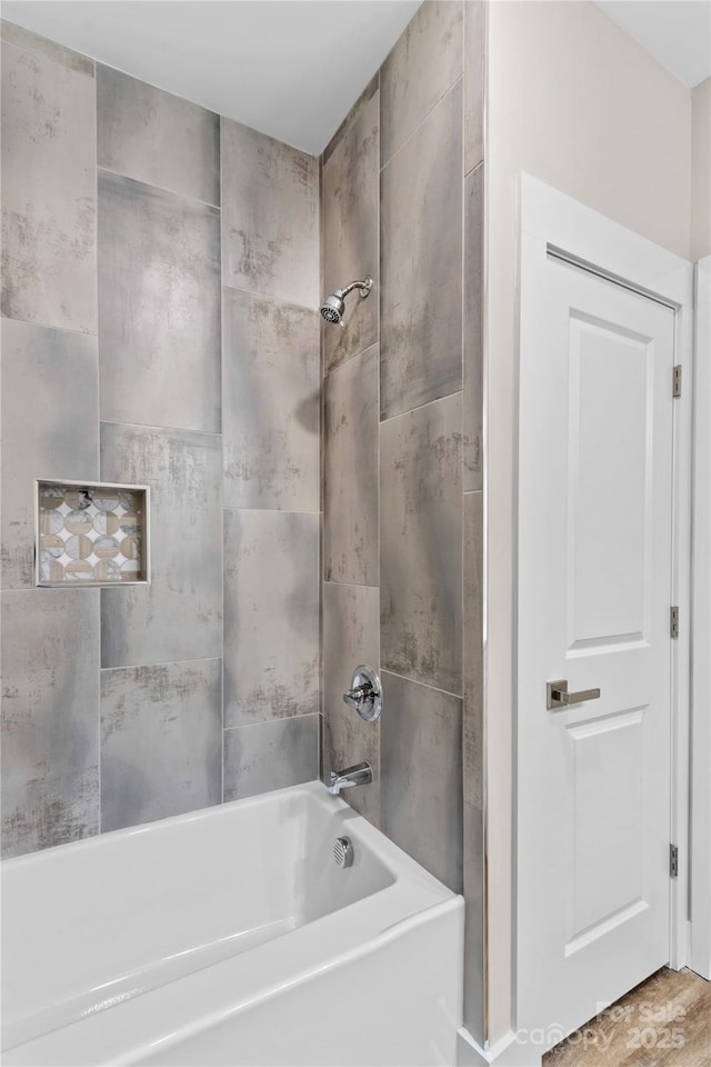 bathroom with shower / washtub combination