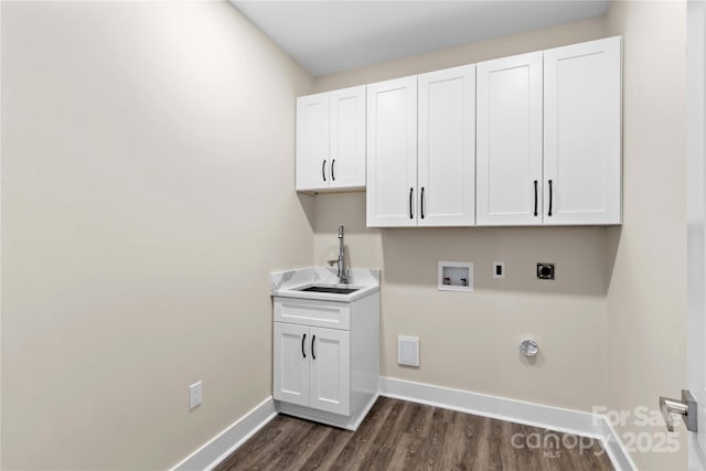 laundry area with baseboards, cabinet space, electric dryer hookup, washer hookup, and a sink