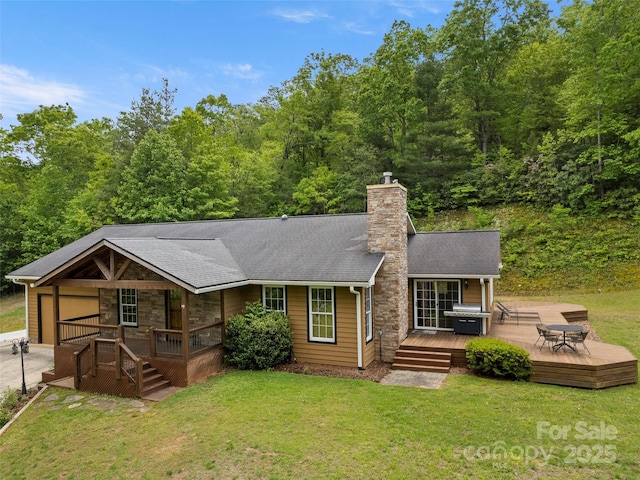 609 N Fork Rd, Black Mountain, NC 28711 - view of front of property with a front yard, a chimney, covered porch, and stone siding
