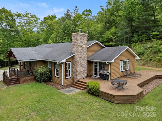 609 N Fork Rd, Black Mountain, NC 28711 - back of house featuring a yard, a shingled roof, a chimney, and a wooden deck
