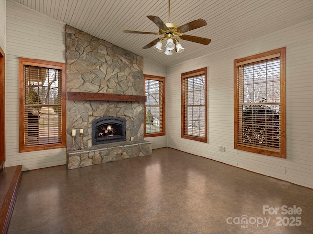 609 N Fork Rd, Black Mountain, NC 28711 - unfurnished living room with ceiling fan, vaulted ceiling, a fireplace, and wooden walls