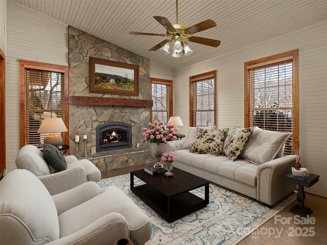 609 N Fork Rd, Black Mountain, NC 28711 - living area with healthy amount of natural light, lofted ceiling, ceiling fan, a fireplace, and wood walls