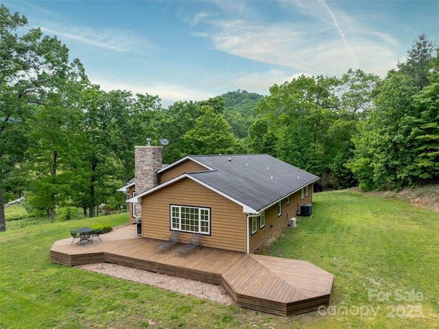 609 N Fork Rd, Black Mountain, NC 28711 - rear view of property featuring a chimney, a lawn, a deck, and cooling unit