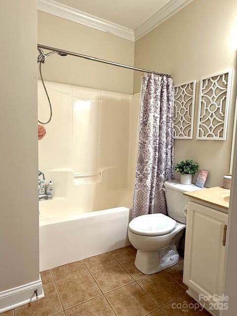 full bathroom featuring vanity, ornamental molding, shower / bath combo with shower curtain, tile patterned floors, and toilet