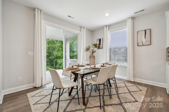 1439 Hubert Graham Way, Tega Cay, SC 29708 - dining area featuring baseboards, healthy amount of natural light, wood finished floors, and recessed lighting