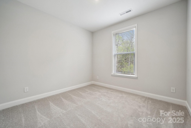 1439 Hubert Graham Way, Tega Cay, SC 29708 - unfurnished room featuring baseboards and light carpet