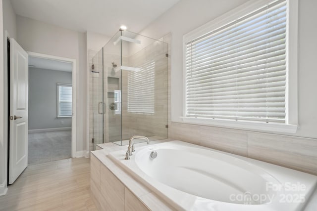 1439 Hubert Graham Way, Tega Cay, SC 29708 - full bathroom featuring a bath and a stall shower