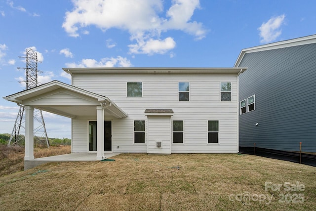 1439 Hubert Graham Way, Tega Cay, SC 29708 - rear view of house with a patio and a lawn