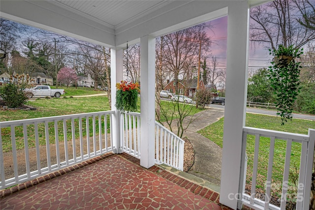 view of patio / terrace featuring a residential view and a porch