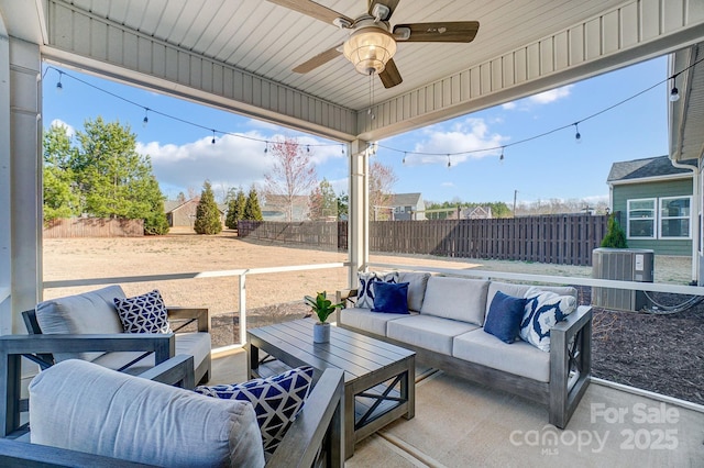 view of patio with a fenced backyard, ceiling fan, central AC, and outdoor lounge area