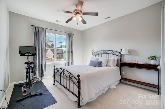 bedroom with baseboards, carpet flooring, and visible vents