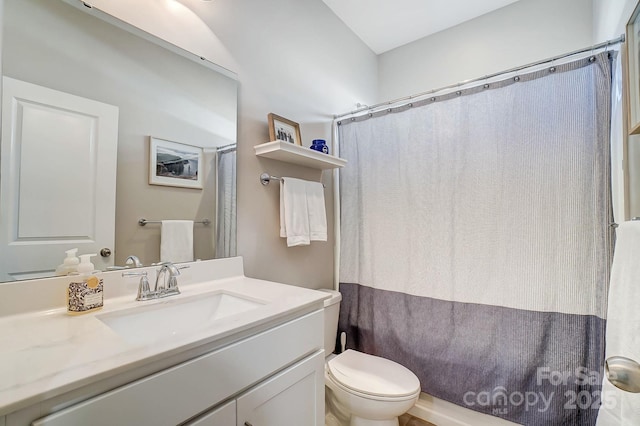 full bath with vanity, toilet, and curtained shower