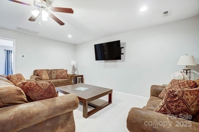 living room with a ceiling fan, recessed lighting, and visible vents