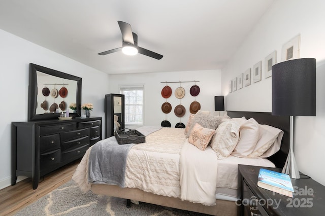 bedroom with wood finished floors and ceiling fan