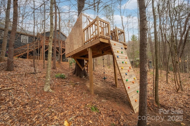 view of property exterior with stairway and a deck