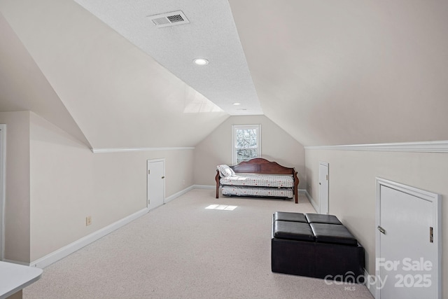 unfurnished bedroom with visible vents, recessed lighting, baseboards, carpet, and lofted ceiling