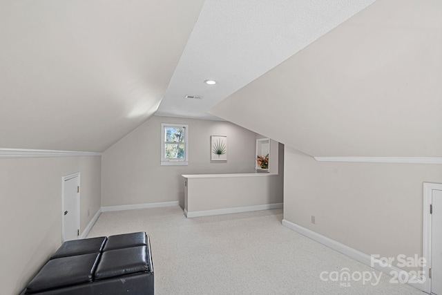 bonus room with visible vents, carpet floors, lofted ceiling, and baseboards