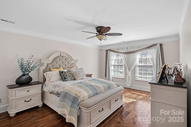 bedroom featuring visible vents, dark wood-style floors, crown molding, baseboards, and ceiling fan