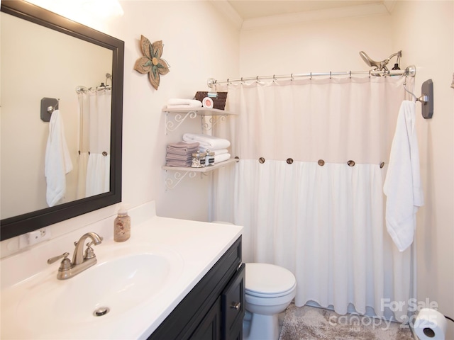 bathroom with toilet, curtained shower, vanity, and ornamental molding