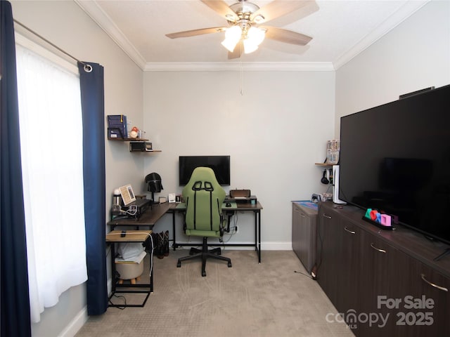 office space with crown molding, light colored carpet, baseboards, and ceiling fan