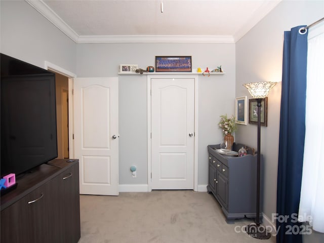 bedroom featuring light carpet, baseboards, and ornamental molding