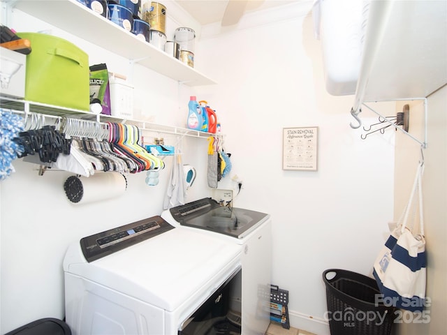 clothes washing area featuring washing machine and dryer and laundry area