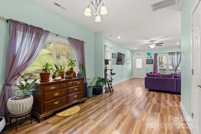 interior space featuring recessed lighting, visible vents, baseboards, and light wood finished floors