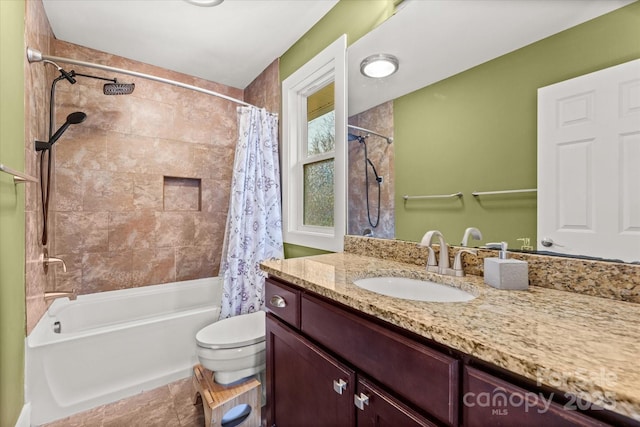 full bathroom featuring vanity, toilet, and shower / tub combo