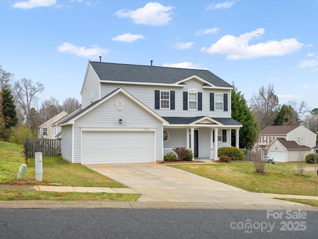 traditional-style home featuring fence, covered porch, a front lawn, concrete driveway, and a garage