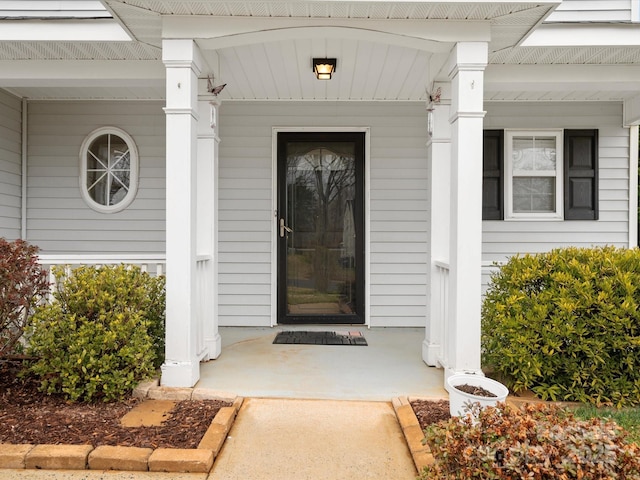 property entrance with covered porch