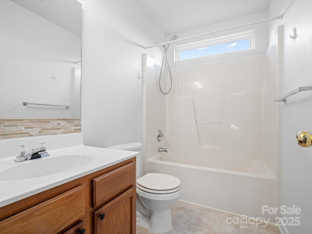 bathroom featuring shower / bathing tub combination, tasteful backsplash, toilet, and vanity