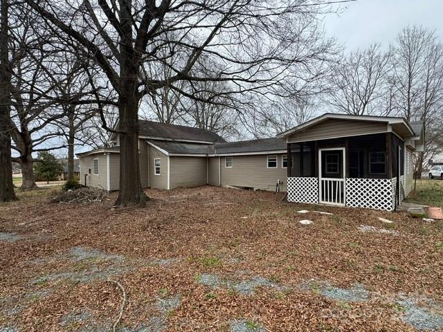 back of property featuring a sunroom