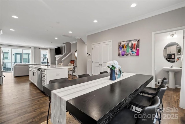 dining room featuring recessed lighting, ornamental molding, and dark wood-style flooring