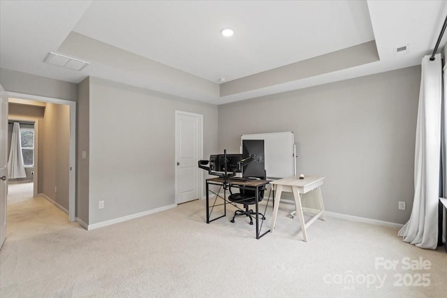 office area with light carpet, visible vents, and baseboards