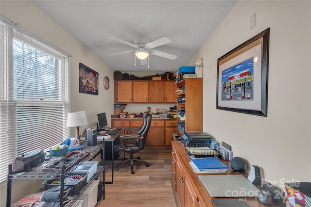 office space with light wood-style flooring and ceiling fan