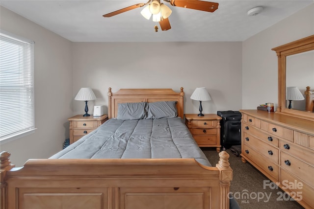 carpeted bedroom with a ceiling fan