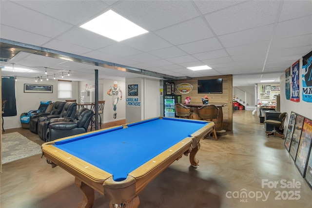 rec room with billiards, a drop ceiling, and concrete floors