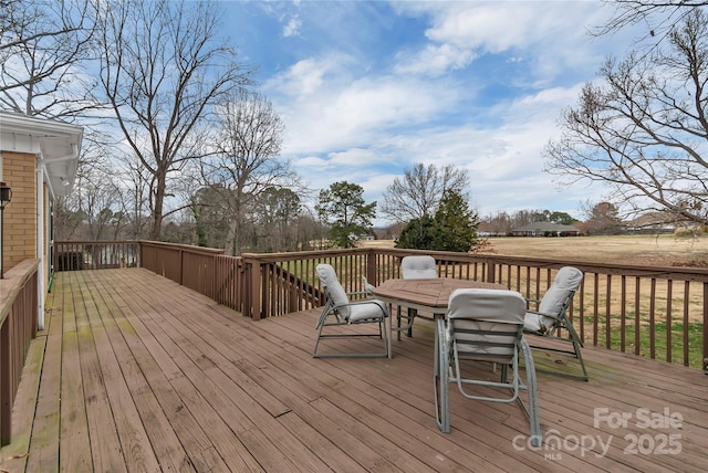 deck with outdoor dining space