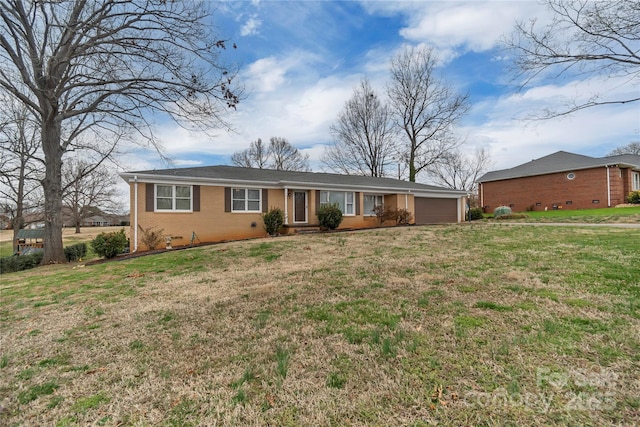 single story home with a front yard, a garage, brick siding, and crawl space