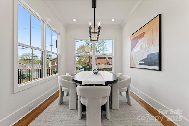 dining area with baseboards, ornamental molding, recessed lighting, and wood finished floors
