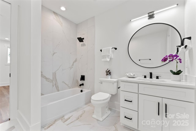 full bathroom with vanity, marble finish floor, toilet, baseboards, and shower / tub combination